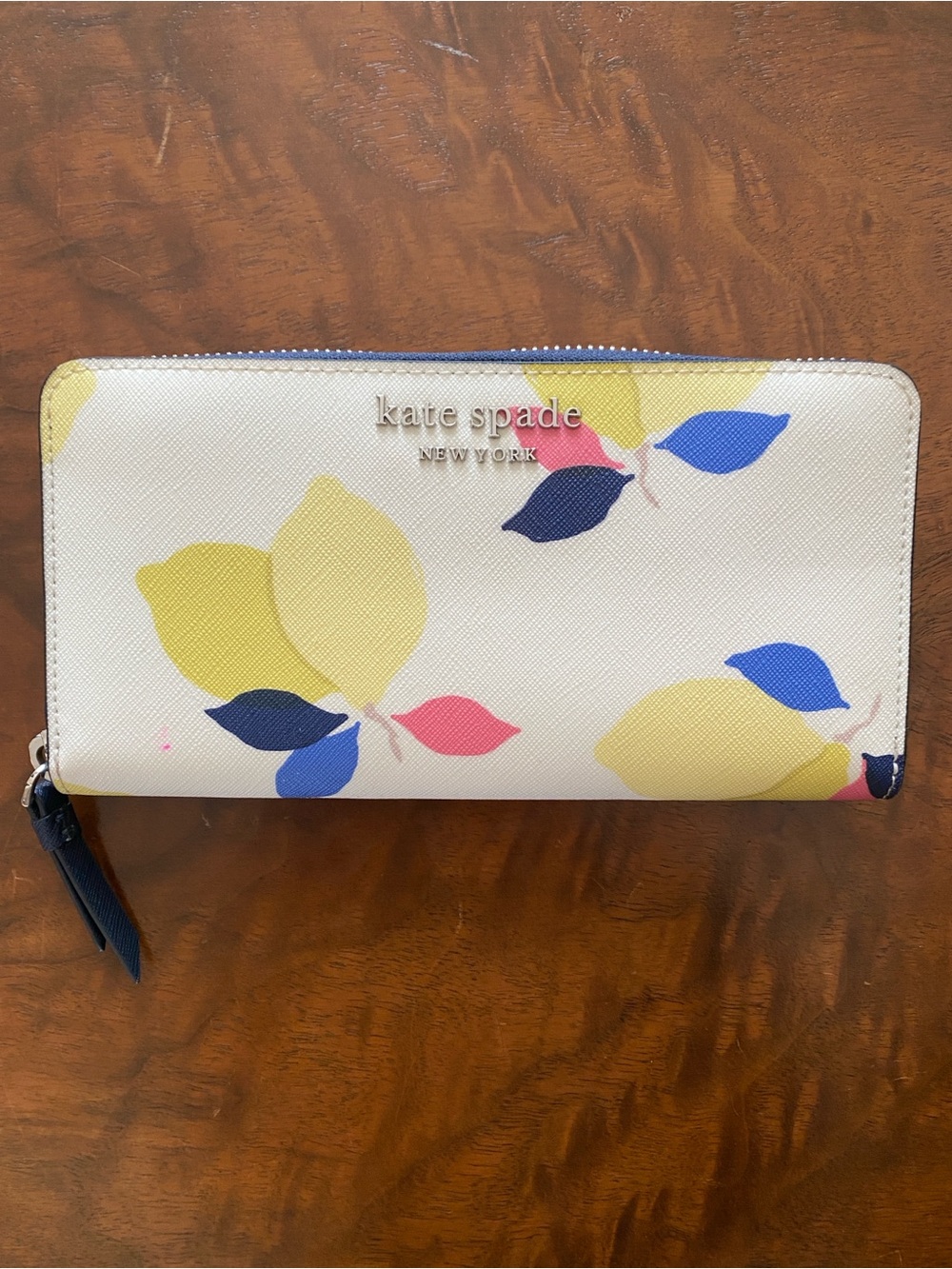 kate spade cream floral zip-around wallet with yellow blue and pink leaves
